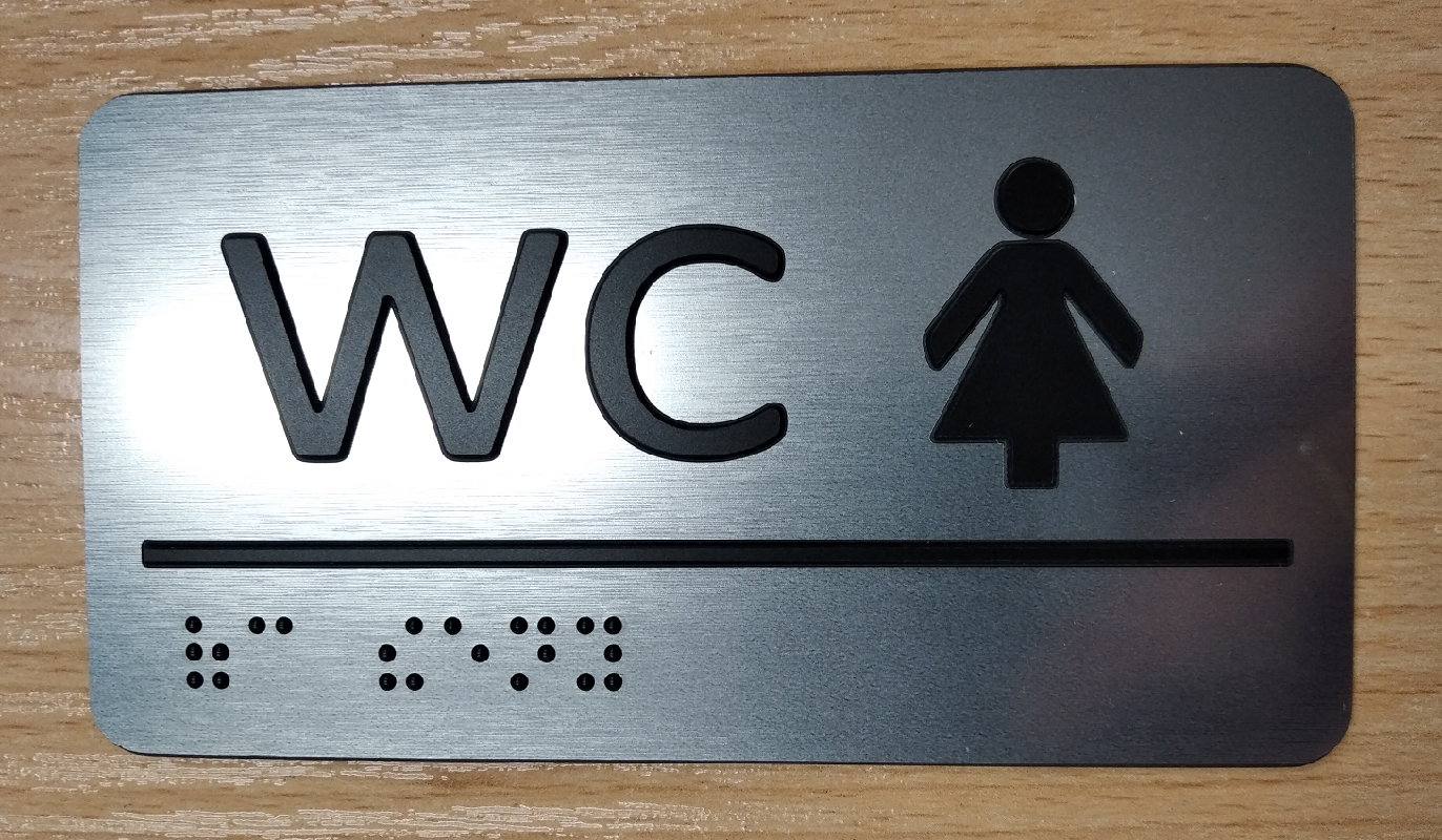 Štítek samolepící - piktogram WC ŽENY, stříbrný